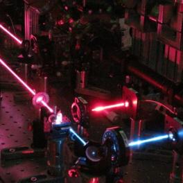 Long-exposure photo of laser-cooling beams trapped barium ions in Olmschenk lab