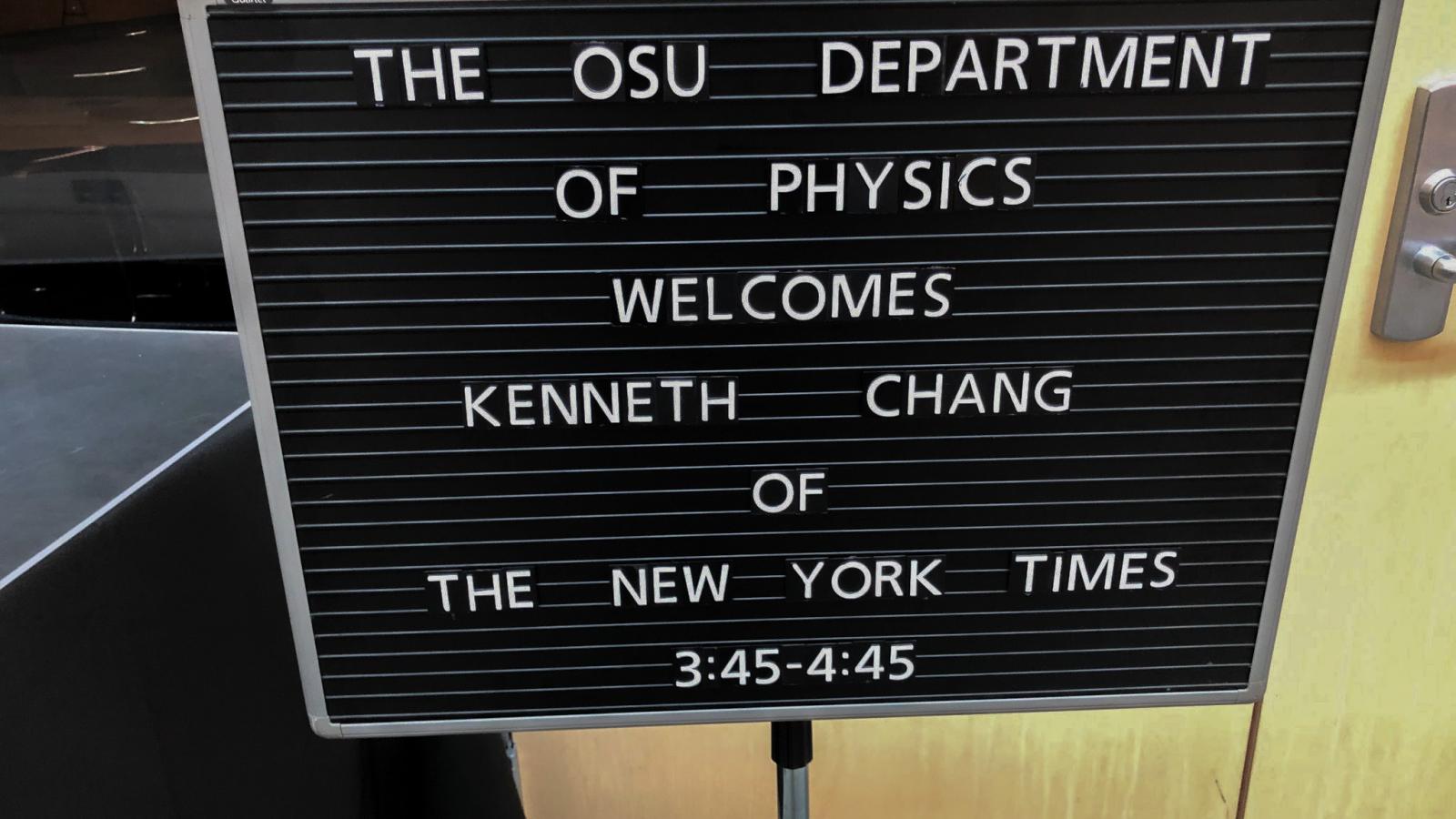 A sign that reads "The Ohio State University's Department of Physics Welcomes Kenneth Chang of The New York Times, 3:45 p.m. to 4:45 p.m."