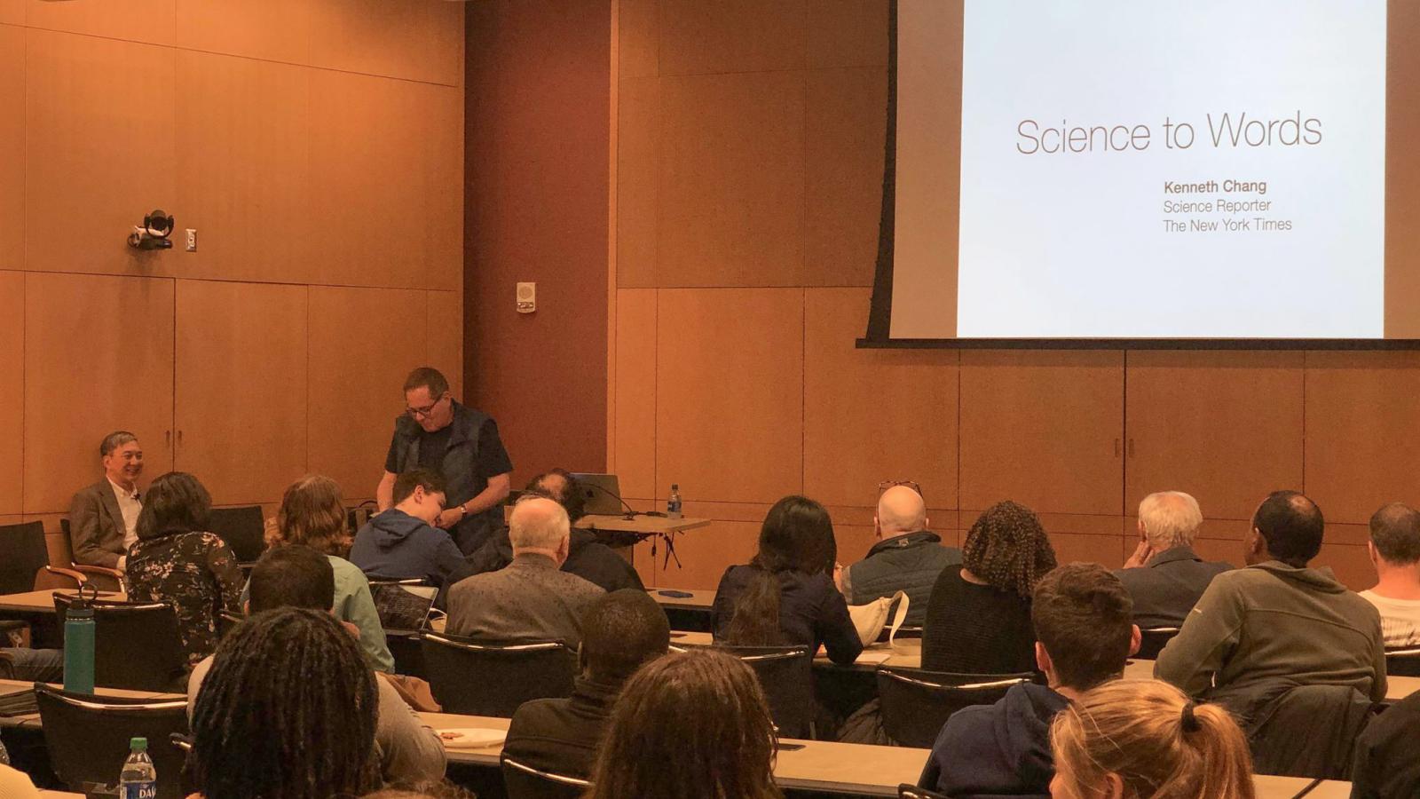 Prof. Lou DiMauro introduces Kenneth Chang to audience before lecture.